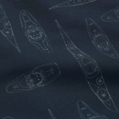 Close-up of navy fabric with subtle kayak prints from the NRS Men's Gear Shirt designed for water activities.