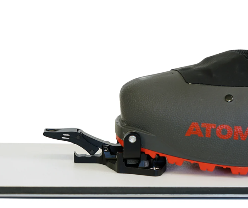 Spark R&D x ATK Tech Toe pieces for hardboot splitboarding touring mode. Image includes an atomic snowboard boot clipped in