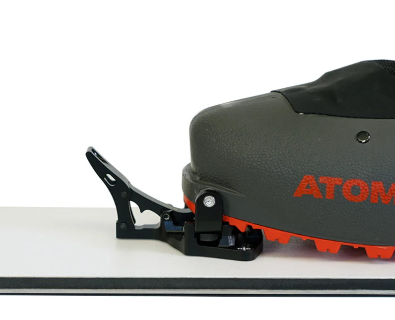 Spark R&D x ATK Tech Toe pieces for hardboot splitboarding touring mode. Image includes an atomic snowboard boot clipped in